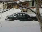 A 1994 Pontiac Grand-Prix in mint (green) condition.