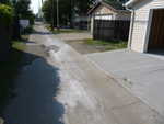 Etching and rinsing the garage left a river of grey down the alley