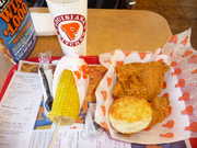 Lunch at Popeyes, with corn-on-the-cob, biscuit, and a pickled jalapeno.