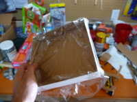 Cardboard electronics box for shape, saran wrap for waterproofing and non-stickiness