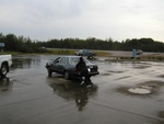 Someone push-starts a car.
Someone else asked me to hold the brake while they started their truck.
Strange gas station.