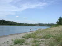 East-ish.  Kayakers and canoeists line the bank.