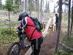 Tom thinks about giving the teeter-totter a go.