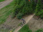 Someone exiting the forest below the Timber chair.