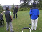 Kamal, Tim and I watch Mike tee off