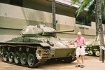 Dad next to a tank at Fort DeRussy