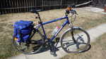 Some proper panniers and a coffee cup holder.  The fender is courtesy a bike someone was tossing.